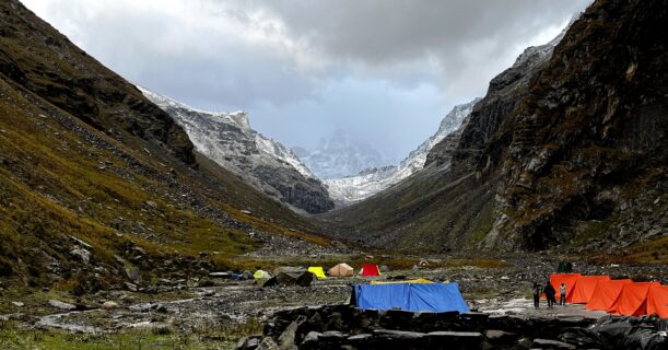 Hampta Pass Trek campsite in a Himalayan mountain valley