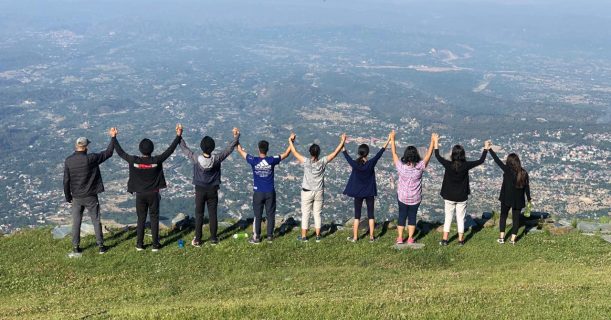 Group Of People Enjoying Breathtaking View on Mountain -Thatharana Trek