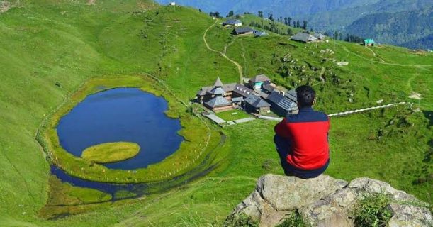 Young Man On Top Of Cliff In Mountains - Prashar Lake