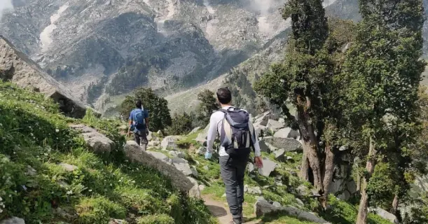 Two Friends Enjoying Striking View of Nature at Snowline Laka Trek