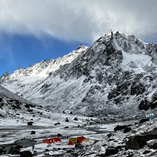 Panoramic view of snow-covered mountains at Hampta Pass