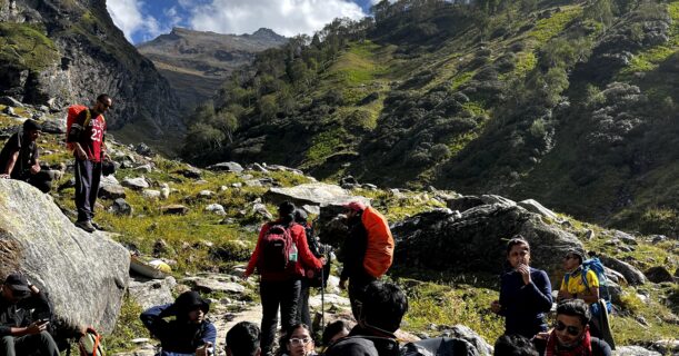 Trekkers hiking through the scenic Hampta Pass mountain trail