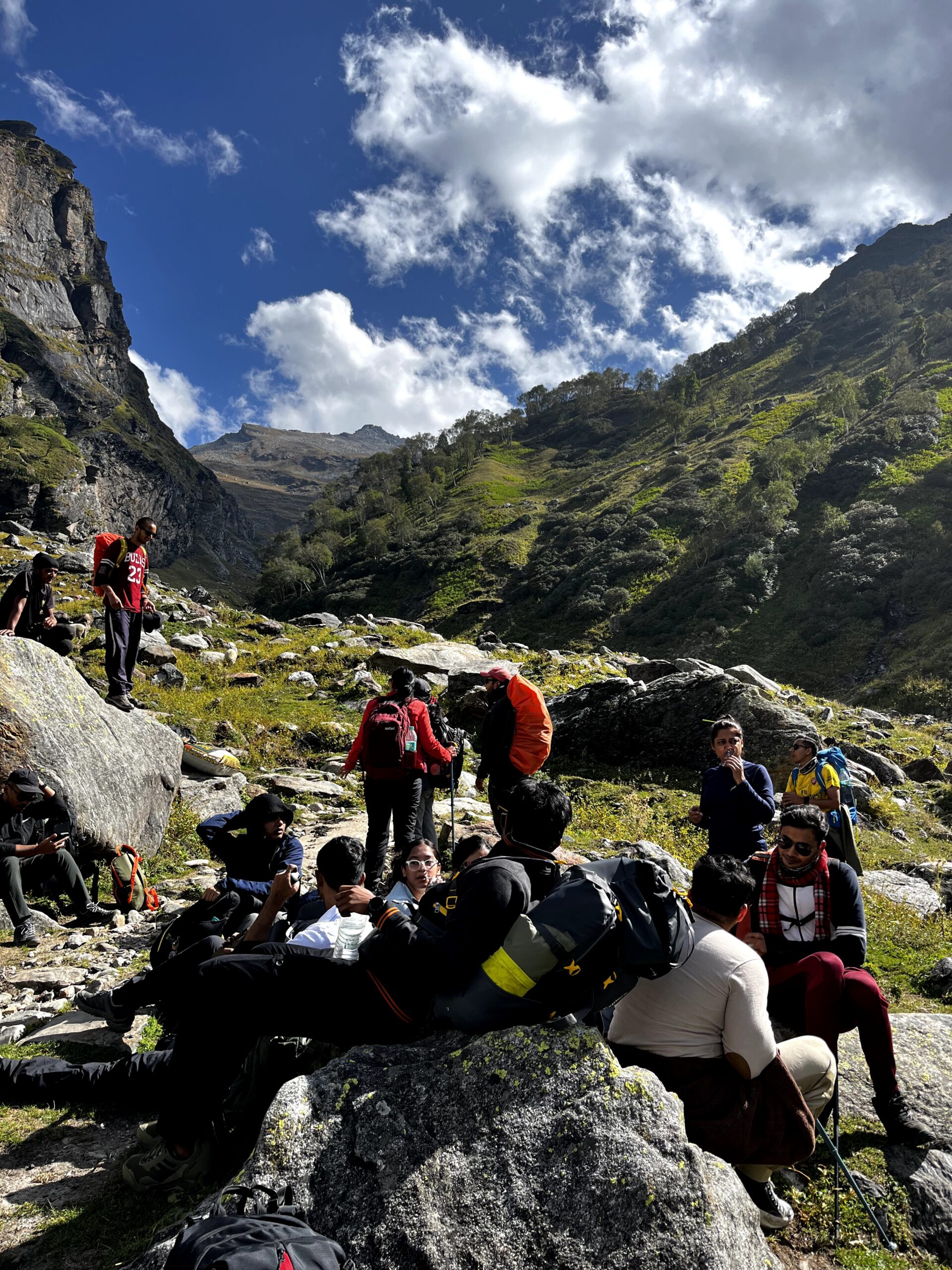 Trekkers hiking through the scenic Hampta Pass mountain trail