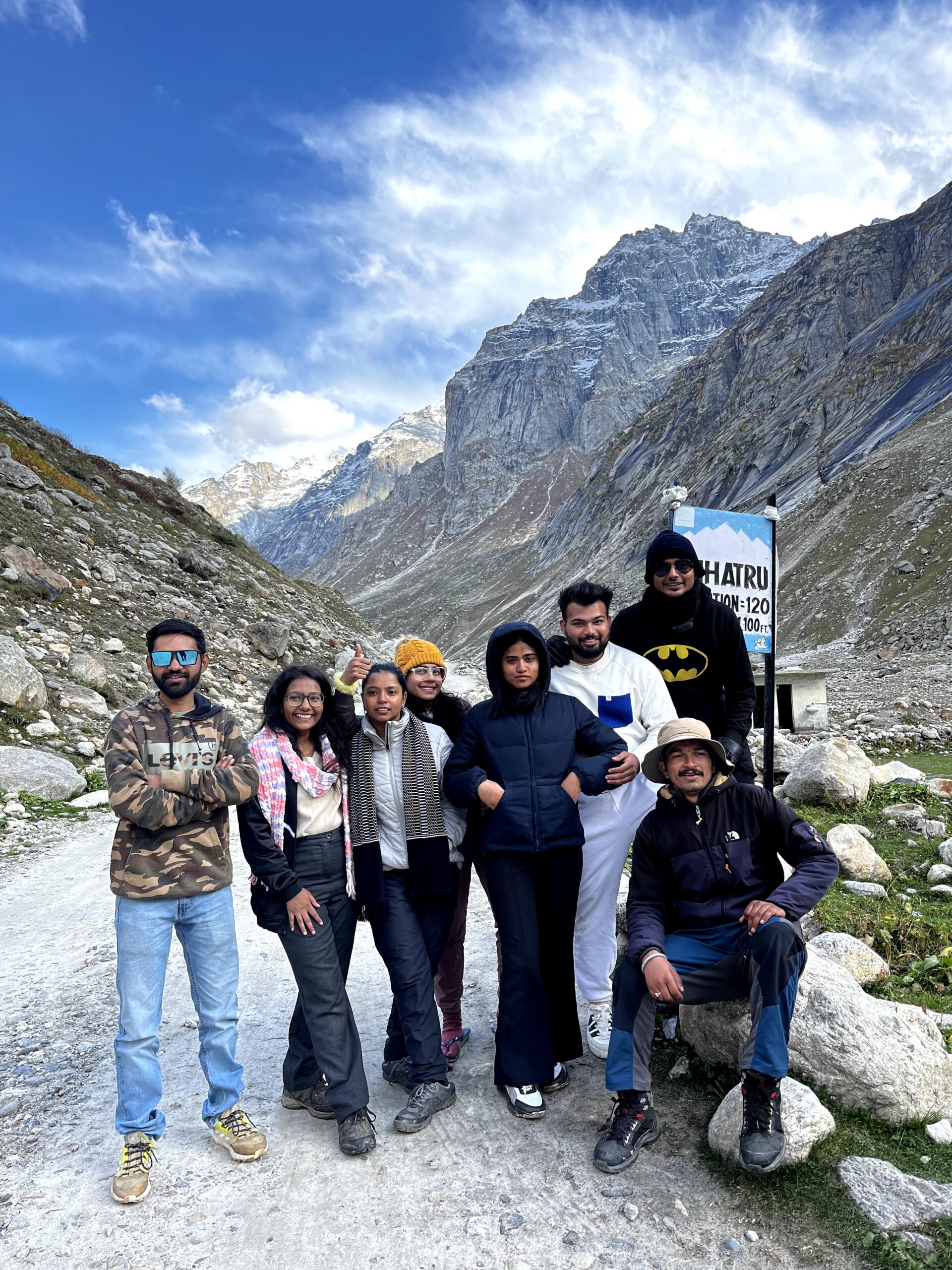 Group of trekkers posing in the Himalayan valley on Hampta Pass Trek