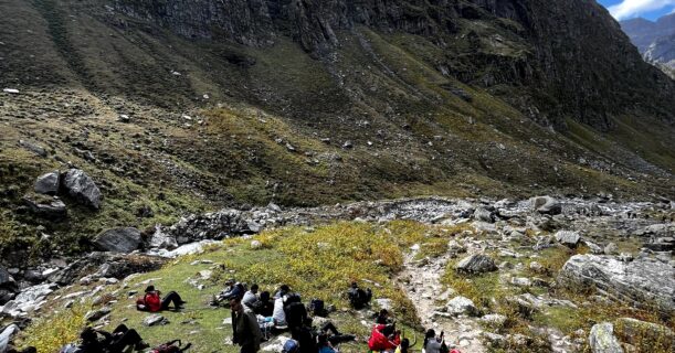 Trekkers taking a break on the Hampta Pass Trek mountain trail