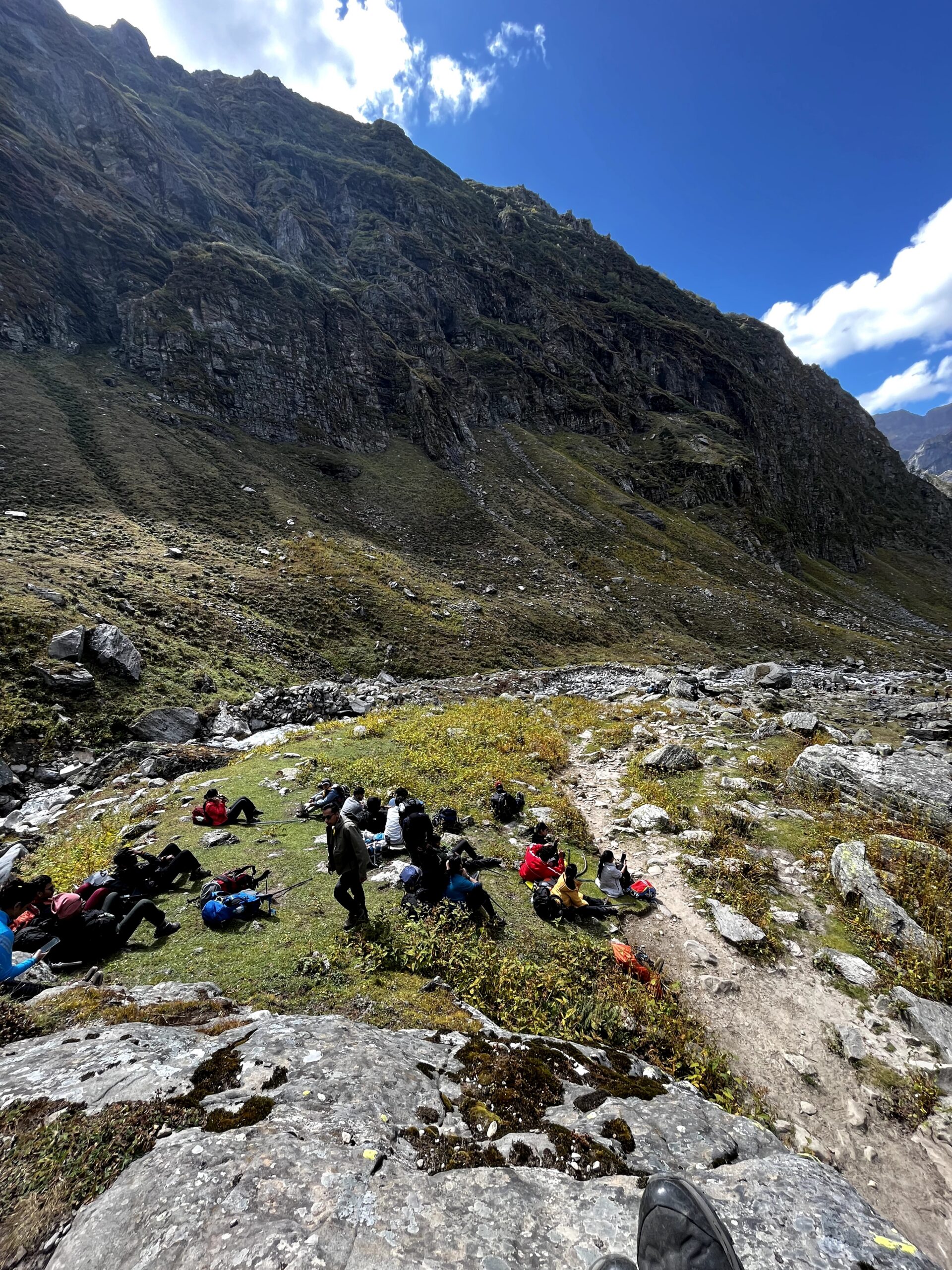 Trekkers taking a break on the Hampta Pass Trek mountain trail