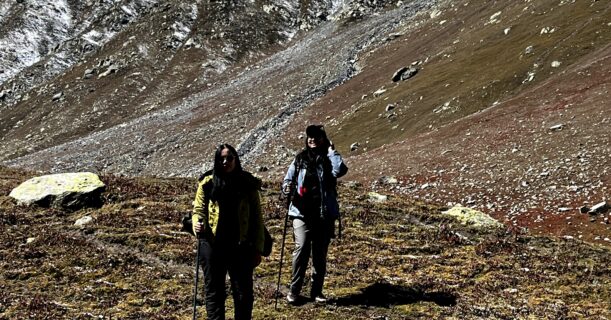 Trekkers hiking through a rocky Himalayan mountain trail
