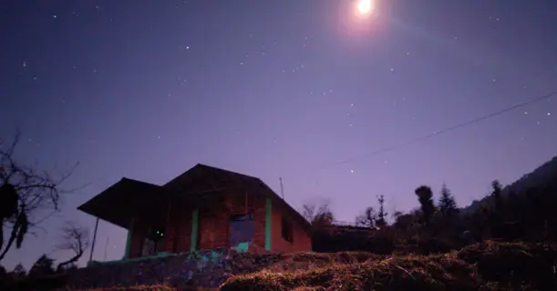 Cottage under a starry night sky in the Himalayas