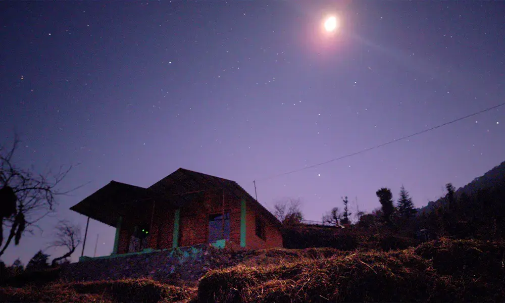 Cottage under a starry night sky in the Himalayas