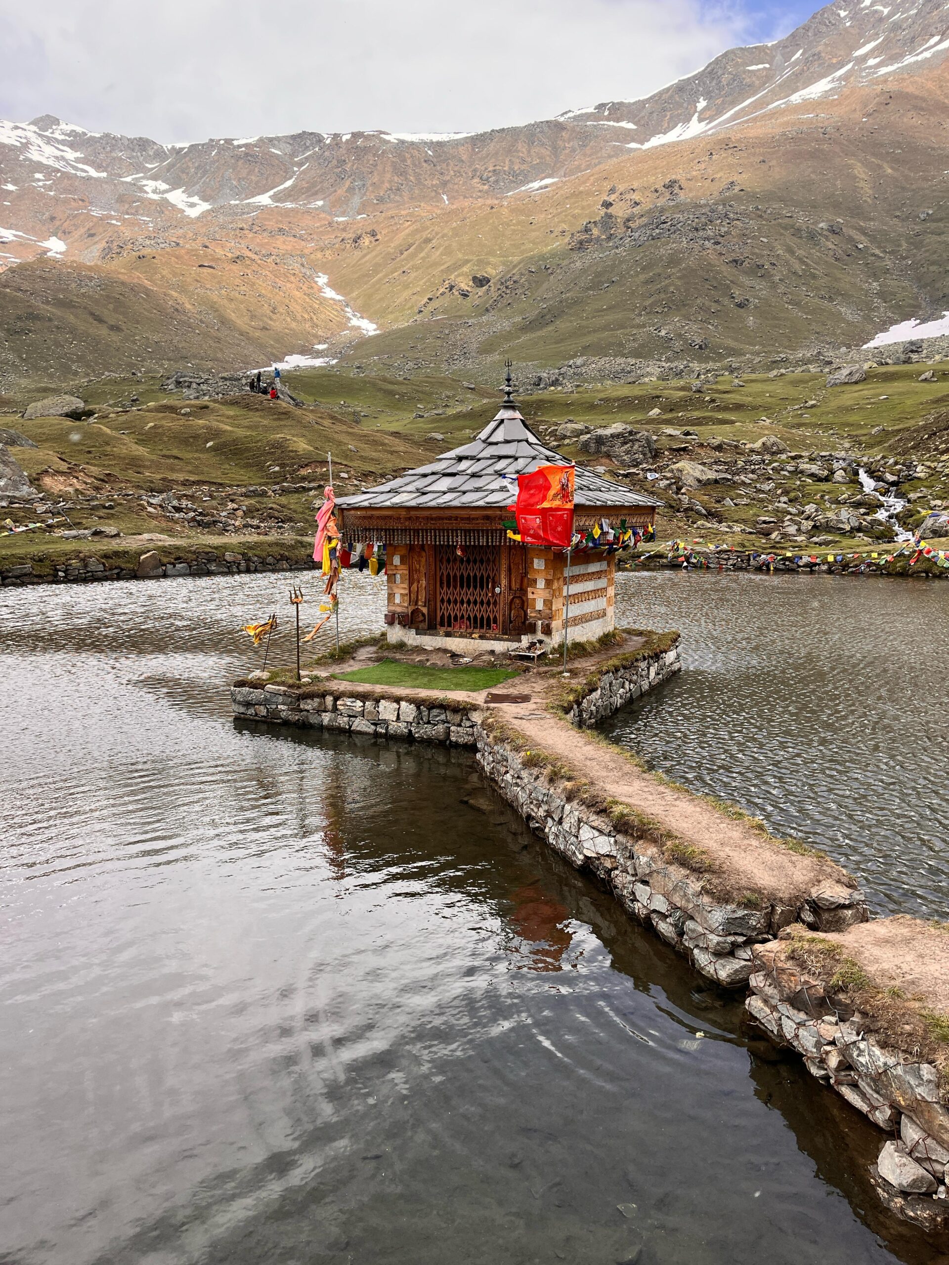 Sacred Krishna temple standing in the middle of Yulla Kanda Lake surrounded by Himalayan mountains